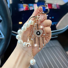 Ojo de la Fortuna™ – Llavero Protector con Cristales y Mano de Fátima