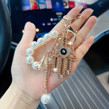 Ojo de la Fortuna™ – Llavero Protector con Cristales y Mano de Fátima