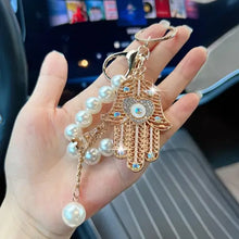 Ojo de la Fortuna™ – Llavero Protector con Cristales y Mano de Fátima