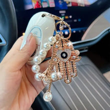 Ojo de la Fortuna™ – Llavero Protector con Cristales y Mano de Fátima